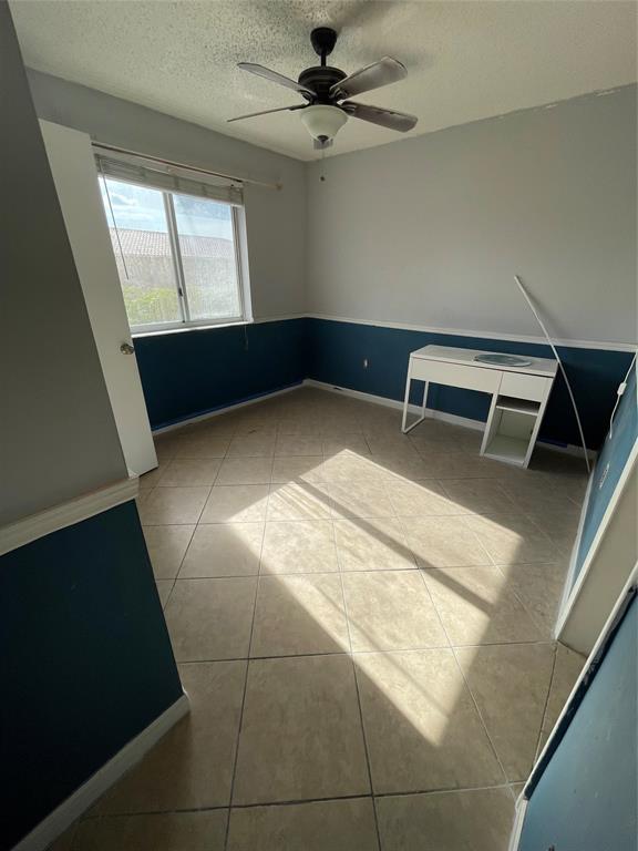 8055 Northwest 8th Street, Unit 4 Miami, FL 33126 - Photo 11 of 11 a view of an empty room with a window