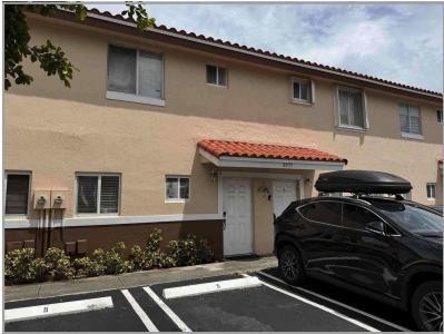 8055 Northwest 8th Street, Unit 4 Miami, FL 33126 - Photo 2 of 11 a front view of a house