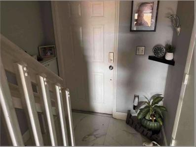 8055 Northwest 8th Street, Unit 4 Miami, FL 33126 - Photo 6 of 11 a view of entryway with wooden floor