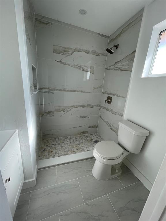 8055 Northwest 8th Street, Unit 4 Miami, FL 33126 - Photo 7 of 11 a bathroom with a toilet and a shower