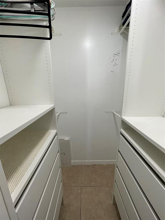 8055 Northwest 8th Street, Unit 4 Miami, FL 33126 - Photo 9 of 11 a view of an empty walk in closet