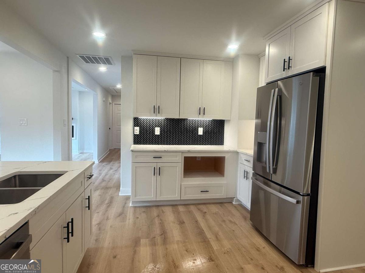 3112 North Avenue Decatur, GA 30033 - Photo 12 of 52 a kitchen with granite countertop a refrigerator and a sink