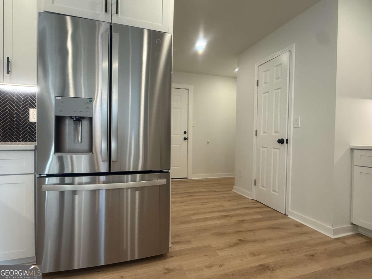 3112 North Avenue Decatur, GA 30033 - Photo 16 of 52 a view of a refrigerator in wooden floor