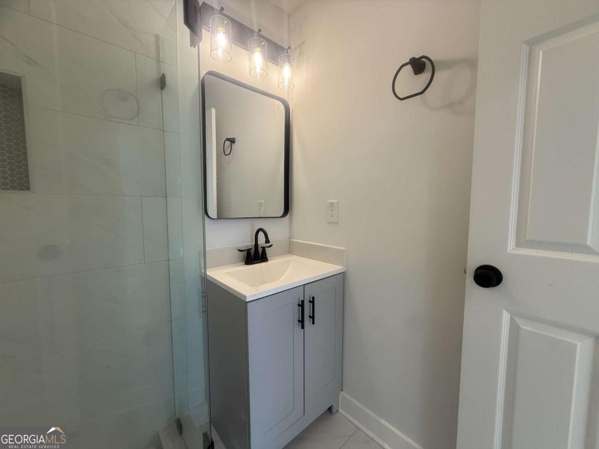 3112 North Avenue Decatur, GA 30033 - Photo 23 of 52 a bathroom with a sink and mirror