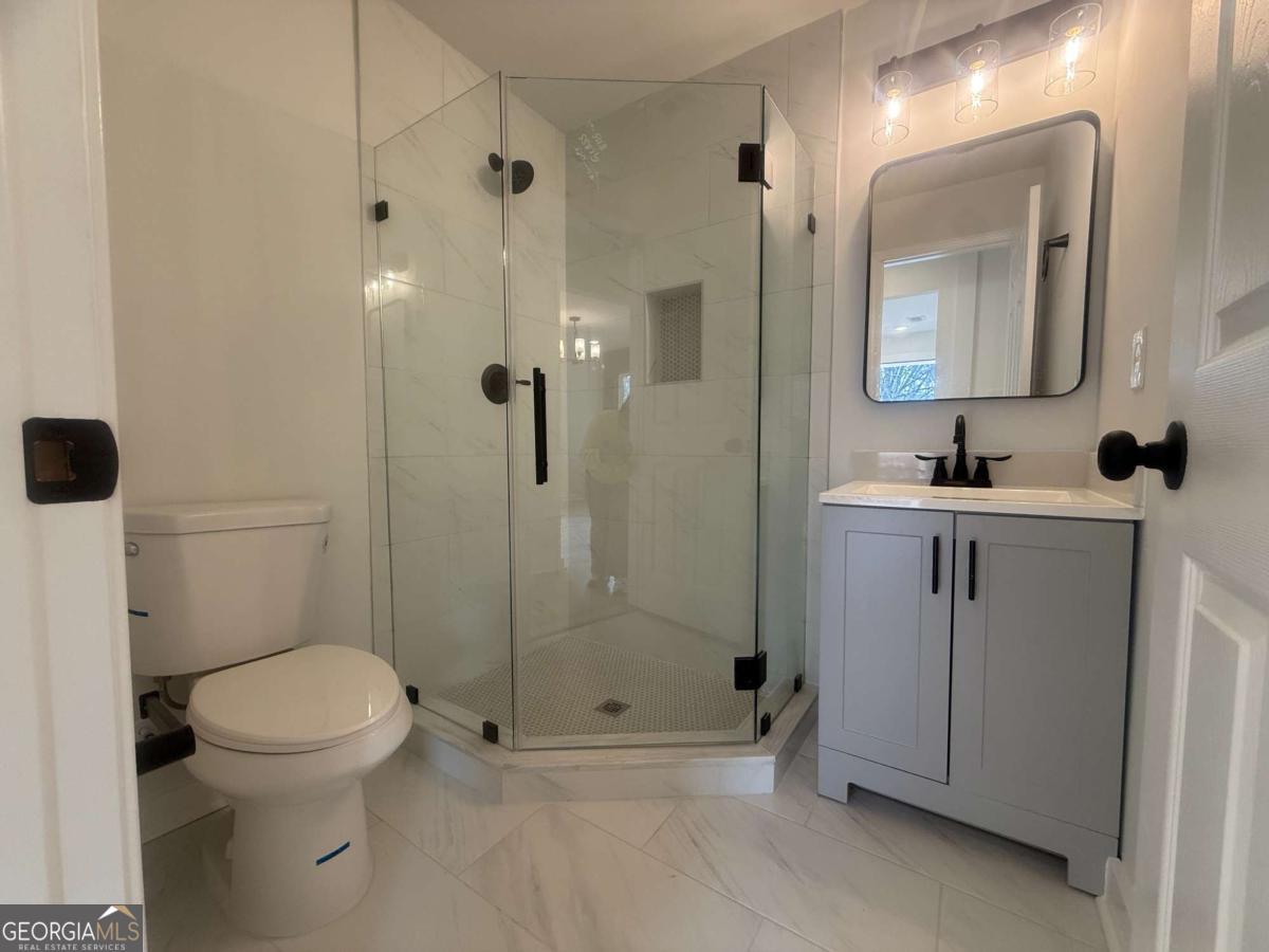 3112 North Avenue Decatur, GA 30033 - Photo 24 of 52 a bathroom with a toilet sink and shower
