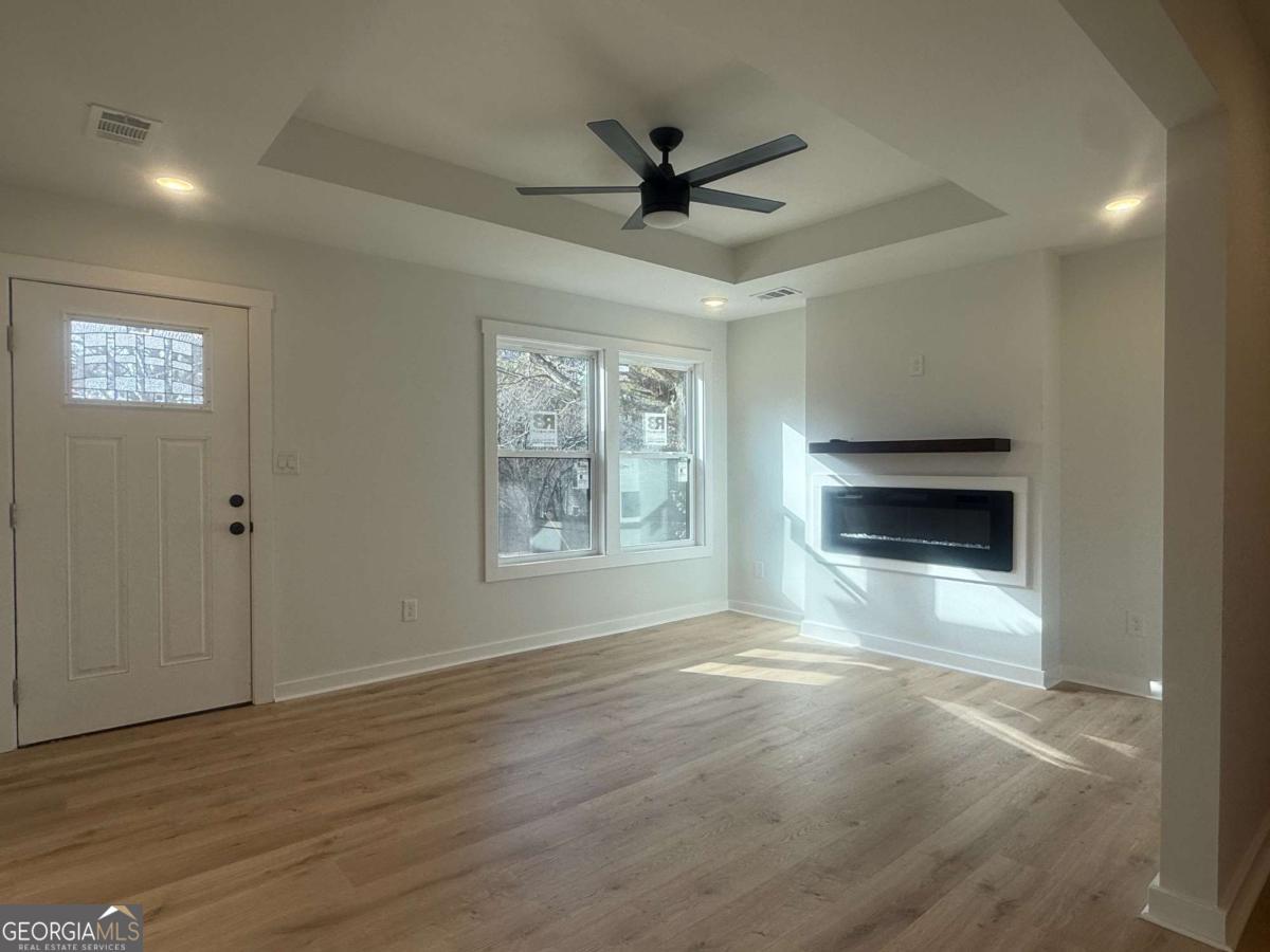 3112 North Avenue Decatur, GA 30033 - Photo 25 of 52 a view of an empty room with a window and wooden floor