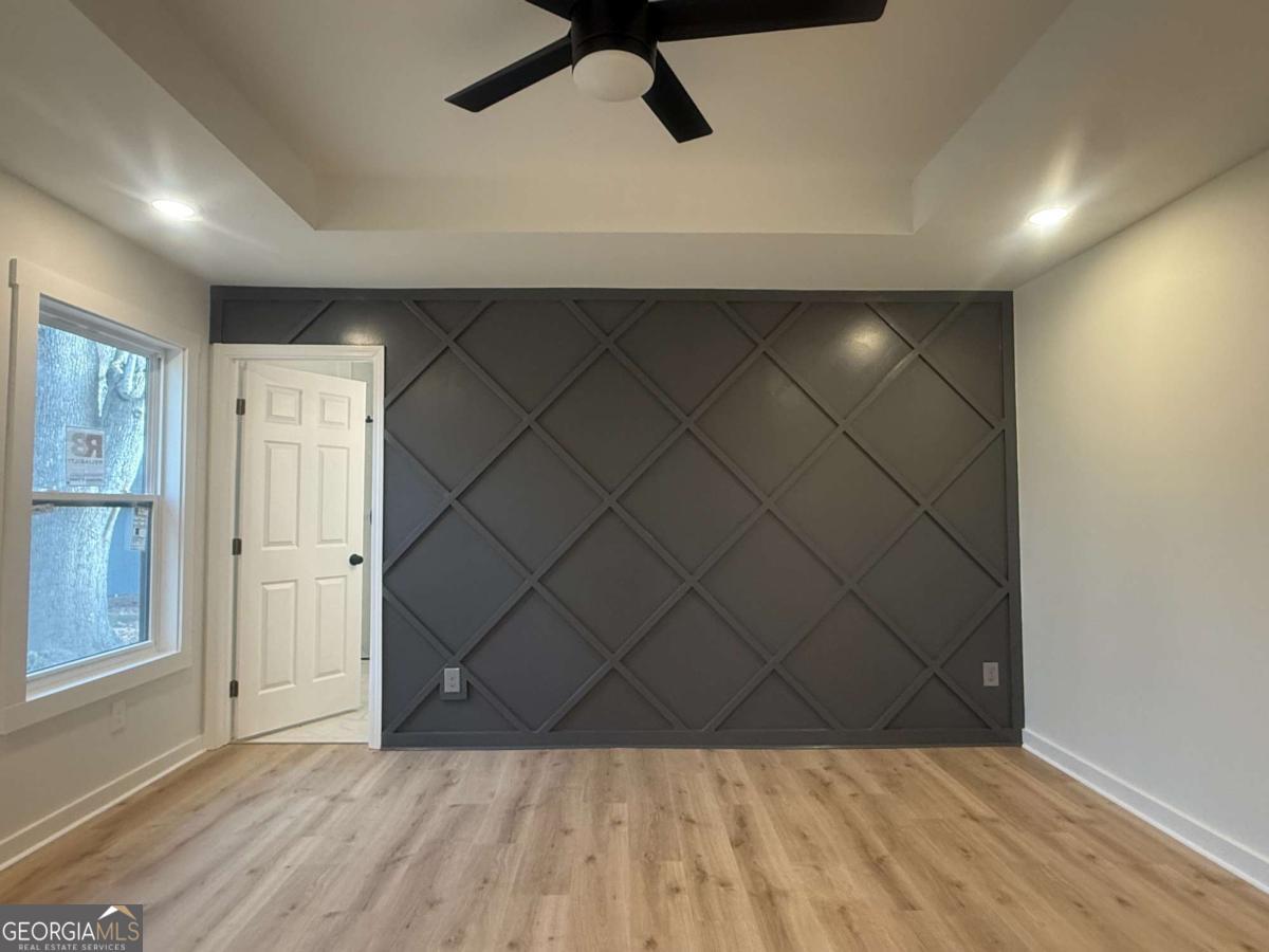 3112 North Avenue Decatur, GA 30033 - Photo 28 of 52 an empty room with wooden floor and windows