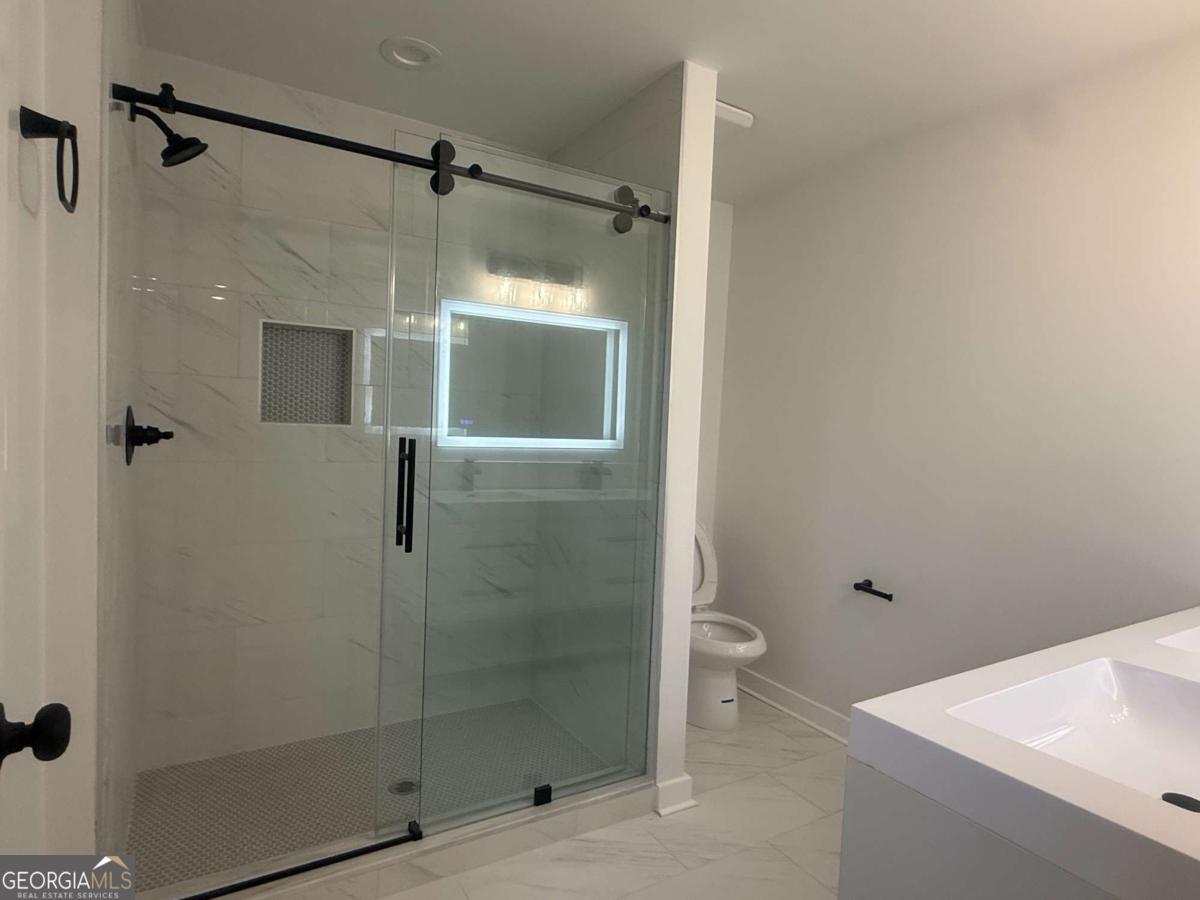 3112 North Avenue Decatur, GA 30033 - Photo 32 of 52 a bathroom with a shower and a toilet