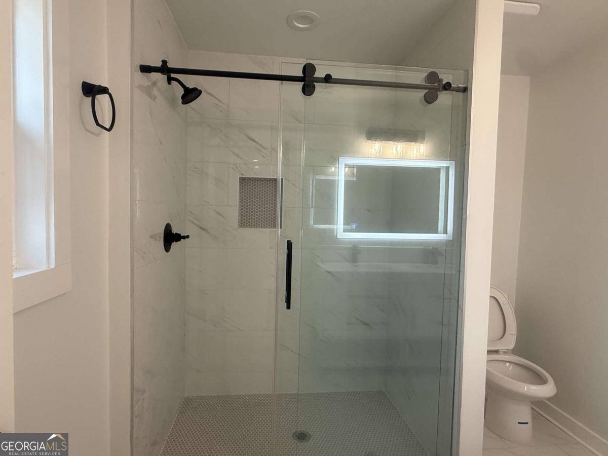 3112 North Avenue Decatur, GA 30033 - Photo 33 of 52 a bathroom with a shower and toilet