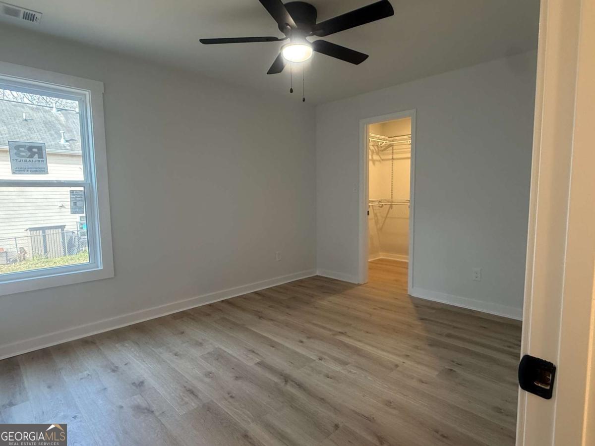 3112 North Avenue Decatur, GA 30033 - Photo 36 of 52 a view of an empty room with wooden floor and a window
