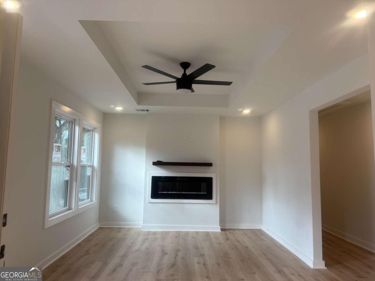 3112 North Avenue Decatur, GA 30033 - Photo 9 of 52 wooden floor in an empty room with a window