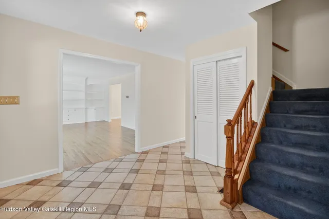 a view of an entryway with wooden floor