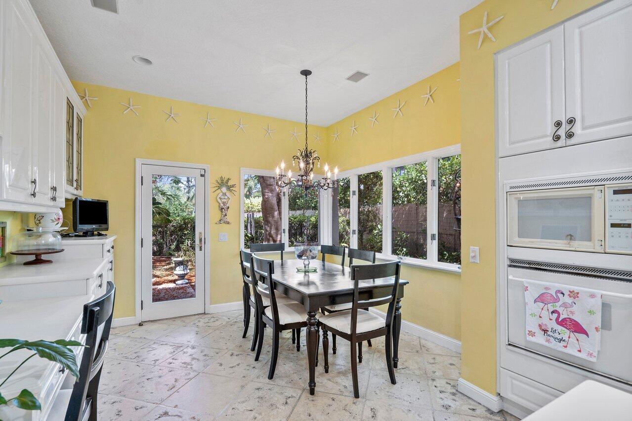243 Florenada Terrace Boca Raton, FL 33486 - Photo 15 of 48 a view of a dining room with furniture window and outside view