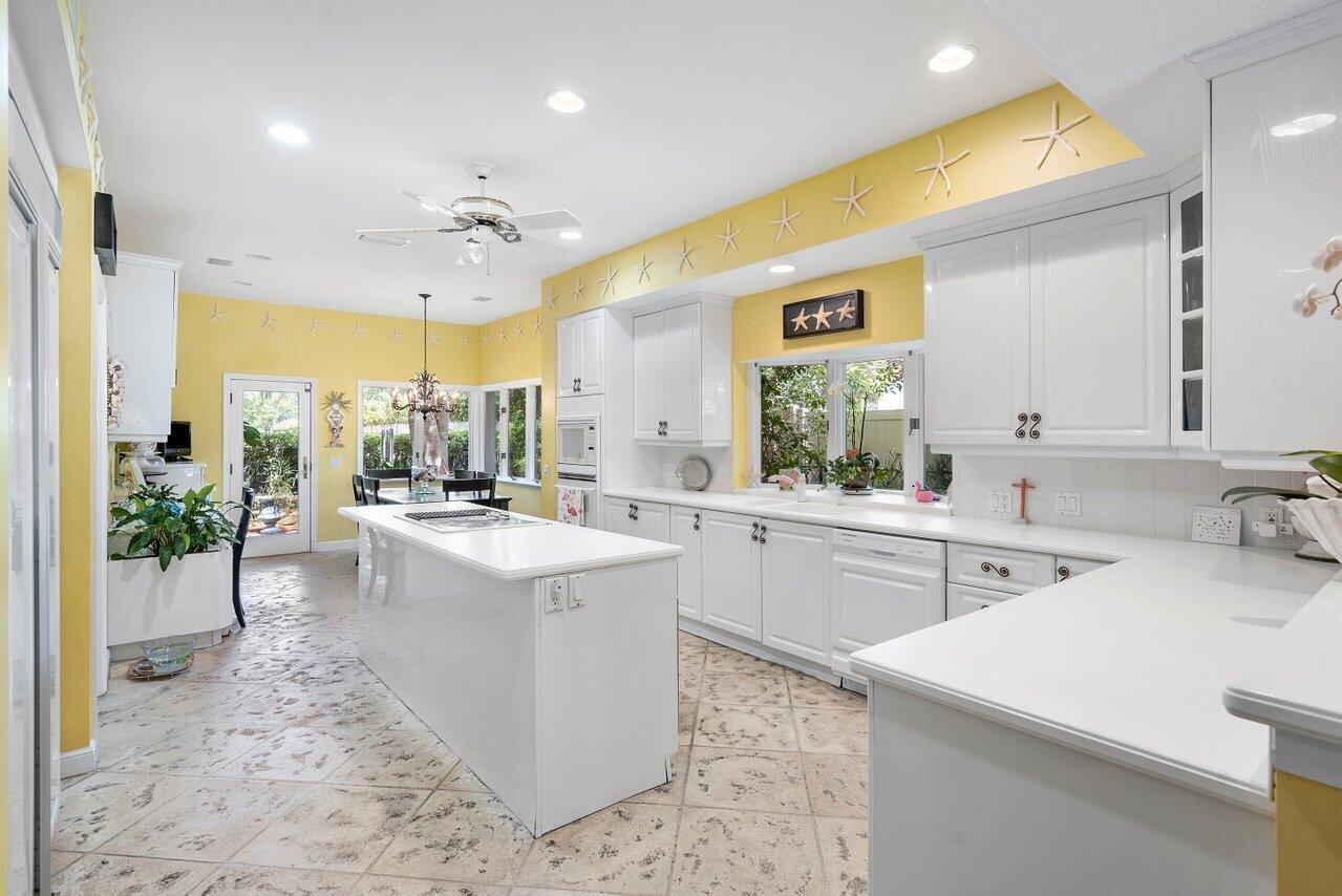 243 Florenada Terrace Boca Raton, FL 33486 - Photo 18 of 48 a kitchen with a sink stove and refrigerator
