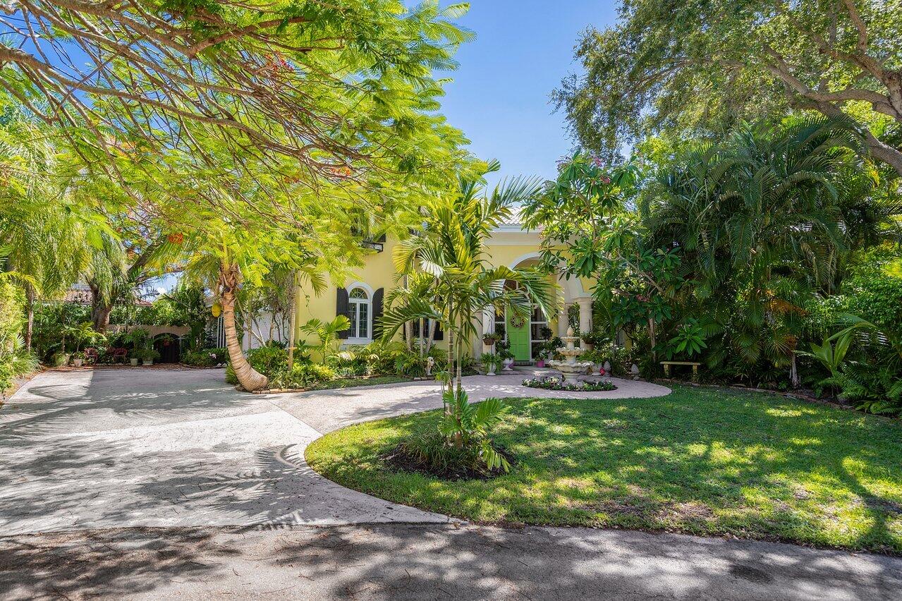 243 Florenada Terrace Boca Raton, FL 33486 - Photo 2 of 48 a view of a backyard with large trees