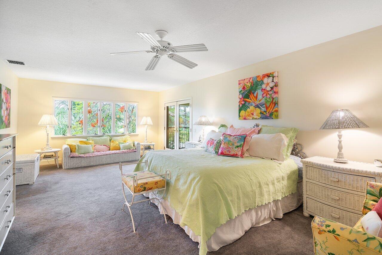 243 Florenada Terrace Boca Raton, FL 33486 - Photo 22 of 48 a bedroom with a bed and a large window