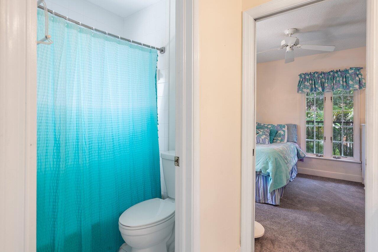 243 Florenada Terrace Boca Raton, FL 33486 - Photo 33 of 48 a bathroom with a toilet and a shower