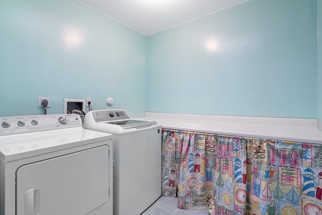 243 Florenada Terrace Boca Raton, FL 33486 - Photo 37 of 48 a utility room with dryer and washer
