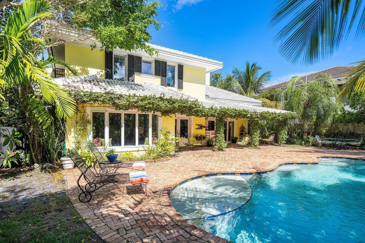 243 Florenada Terrace Boca Raton, FL 33486 - Photo 41 of 48 a front view of a house with a yard