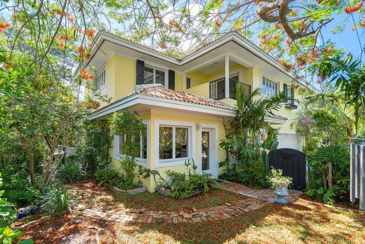 243 Florenada Terrace Boca Raton, FL 33486 - Photo 43 of 48 a front view of a house with garden