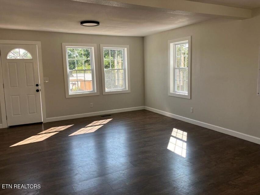 1486 Short Street Morristown, TN 37814 - Photo 6 of 12 a view of empty room with wooden floor and fan