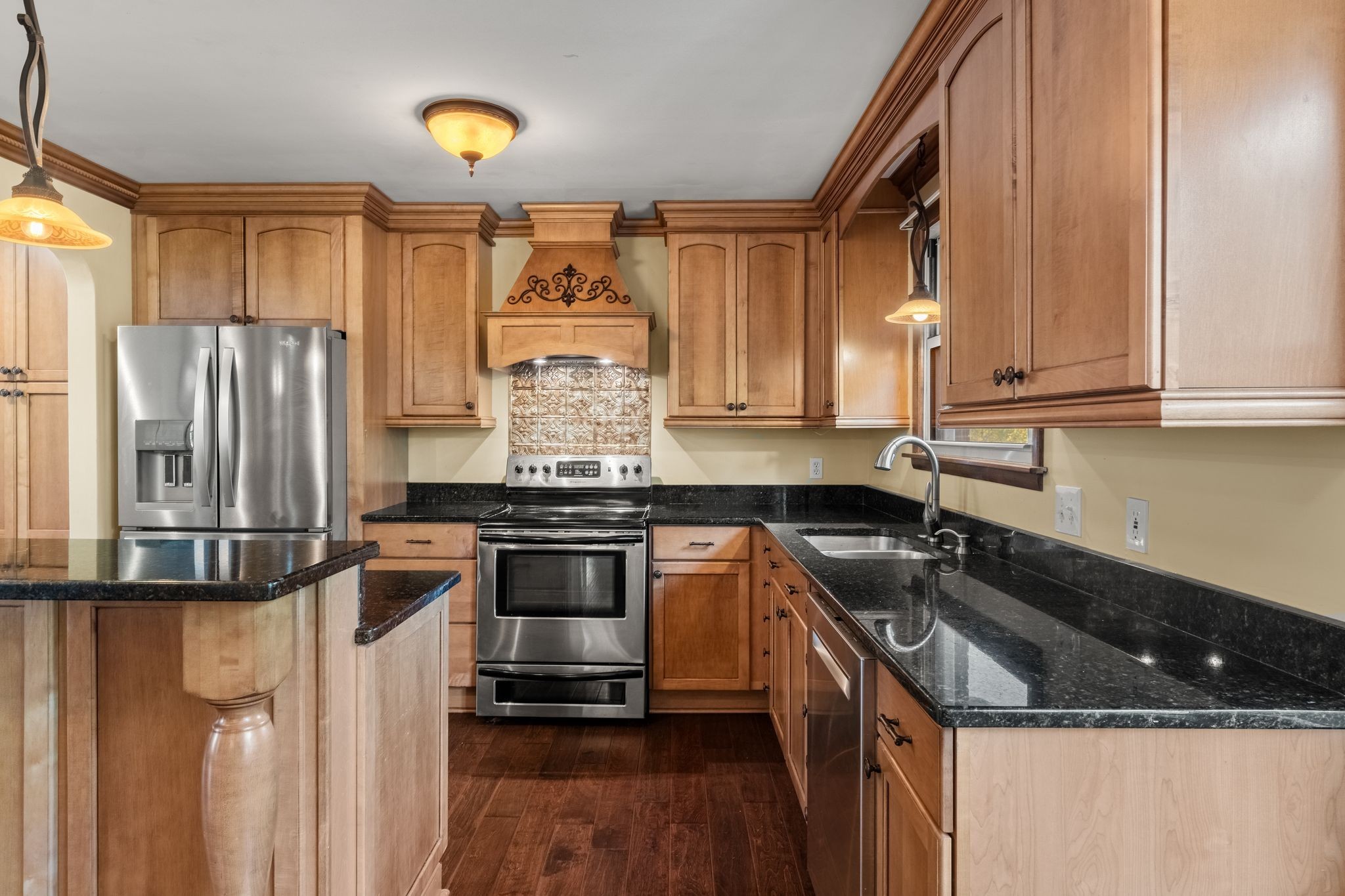 104 Meadowvue Drive Hendersonville, TN 37075 - Photo 14 of 43 a kitchen with a sink a refrigerator and cabinets
