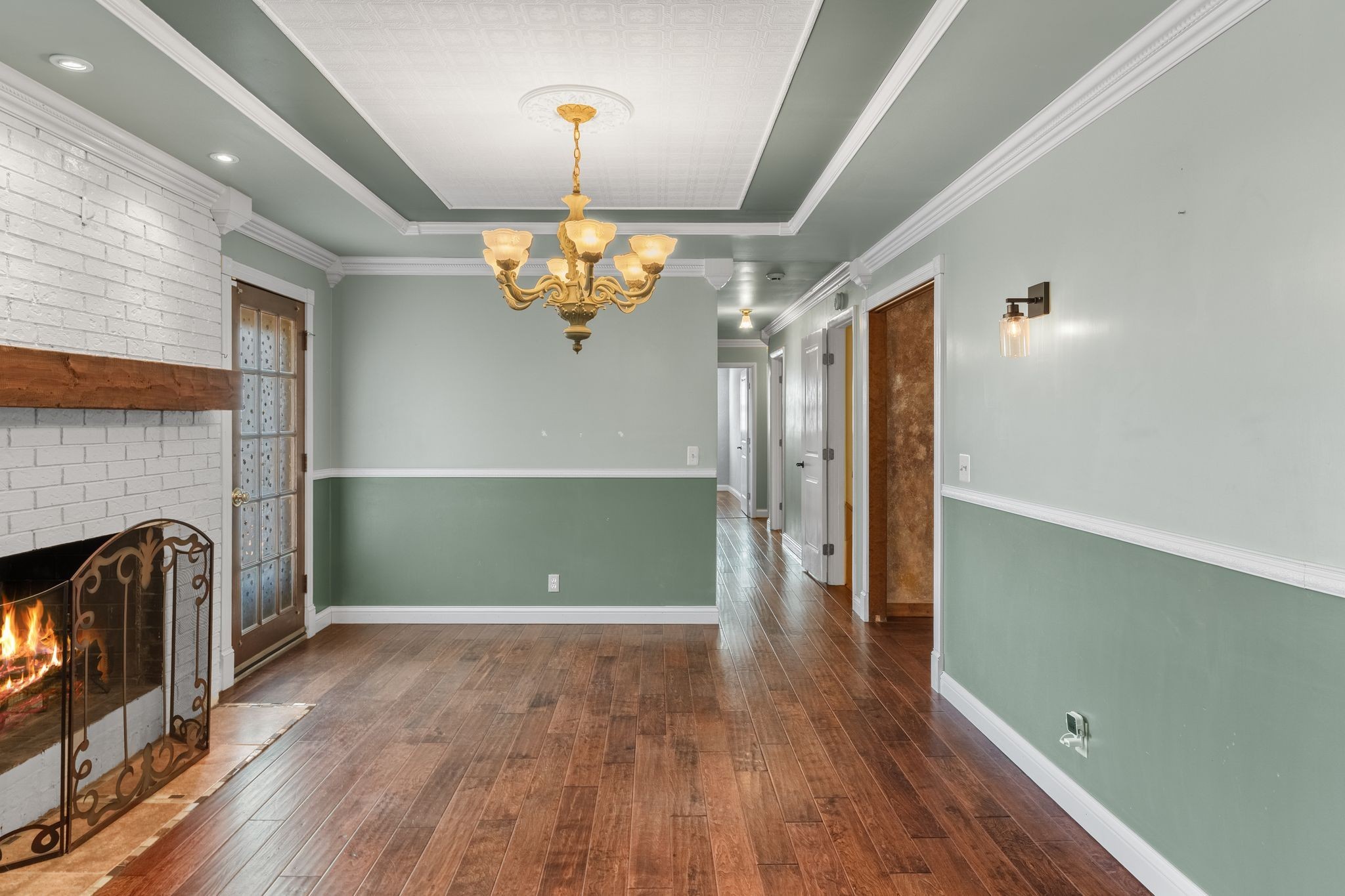 104 Meadowvue Drive Hendersonville, TN 37075 - Photo 20 of 43 an empty room with wooden floor fireplace and staircase