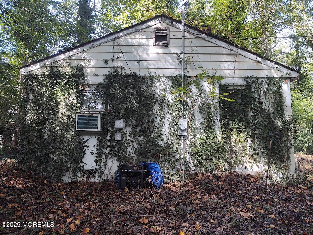 119 A Brindletown Road Cookstown, NJ 08533 - Photo 2 of 12 a backyard of a house with lots of plants and trees
