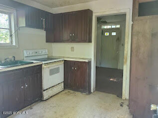 119 A Brindletown Road Cookstown, NJ 08533 - Photo 6 of 12 a kitchen with a sink and cabinets