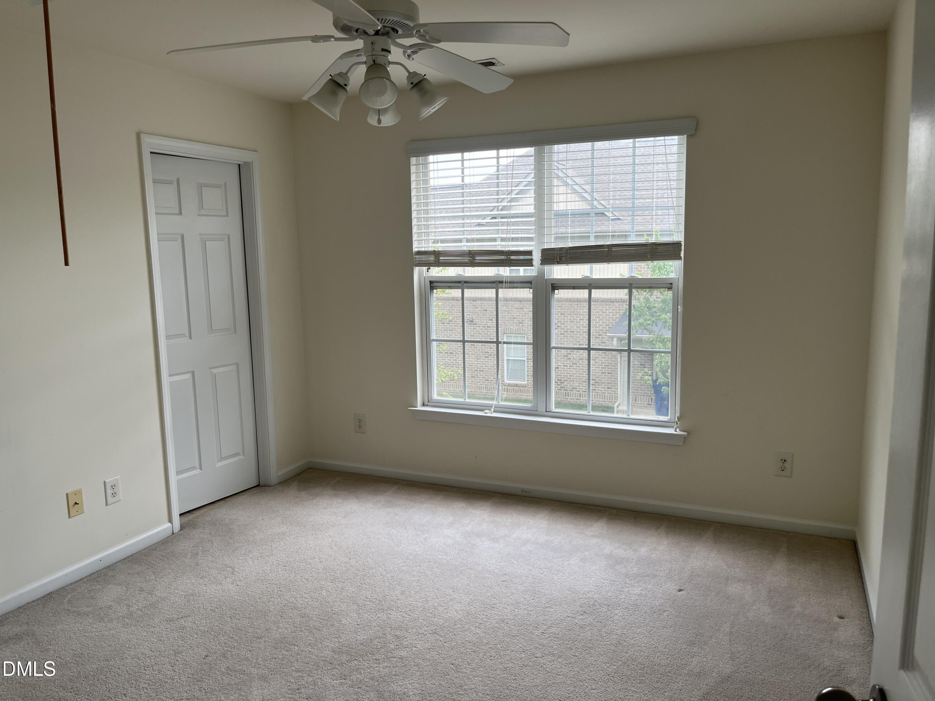 9827 Grettle Court Raleigh, NC 27617 - Photo 7 of 10 an empty room with a window