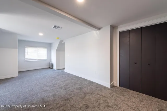 a view of an empty room and window