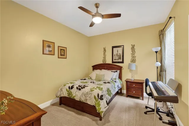 a bedroom with a bed and chair