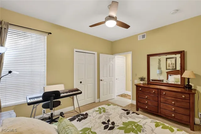 a living room with a couch and a dresser
