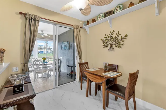 a dining room with furniture and window