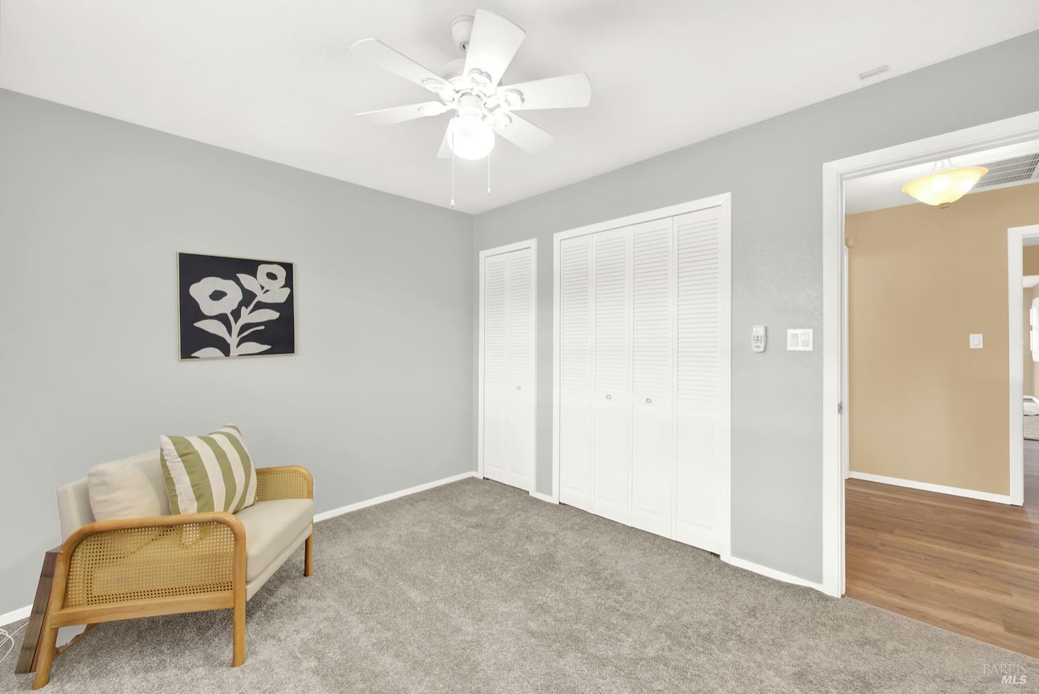 112 East Kentucky Street Fairfield, CA 94533 - Photo 32 of 70 a living room with furniture and a ceiling fan