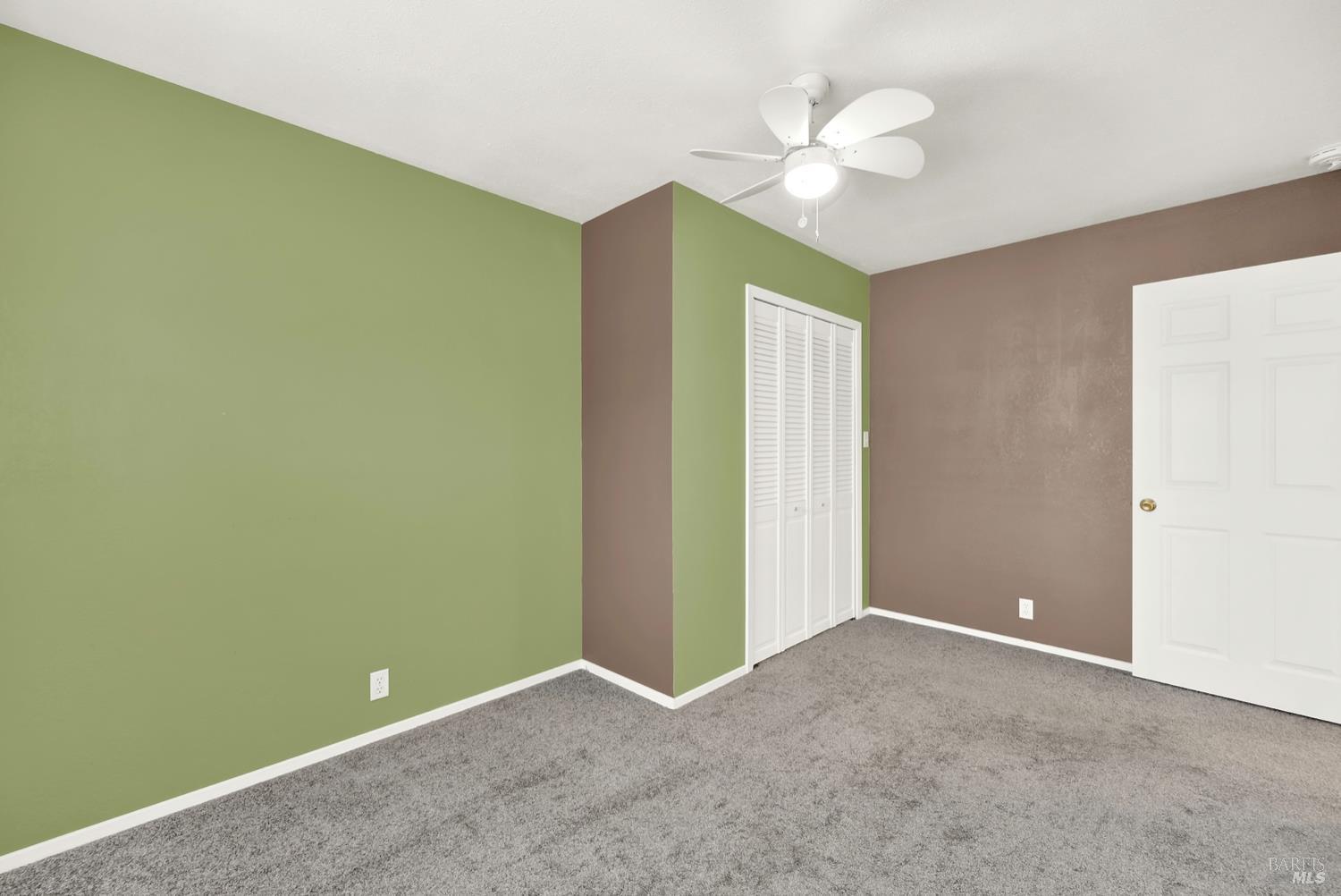 112 East Kentucky Street Fairfield, CA 94533 - Photo 37 of 70 an empty room with a ceiling fan and a chandelier fan