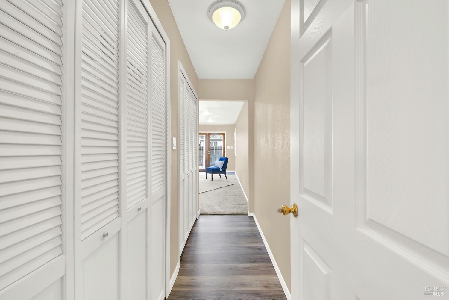 112 East Kentucky Street Fairfield, CA 94533 - Photo 39 of 70 a view of a hallway with wooden floor and staircase