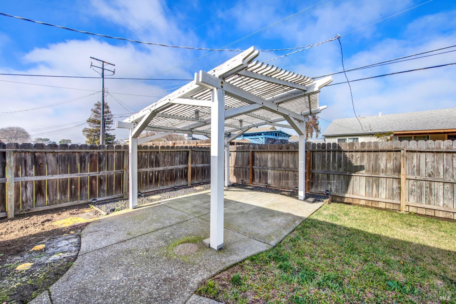112 East Kentucky Street Fairfield, CA 94533 - Photo 65 of 70 a view of a backyard with wooden floor and iron fence