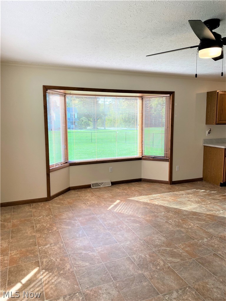 7682 Sanborn Road Ashtabula, OH 44004 - Photo 10 of 35 Dining area off the kitchen with loads of windows for beautiful light. 15 x 15