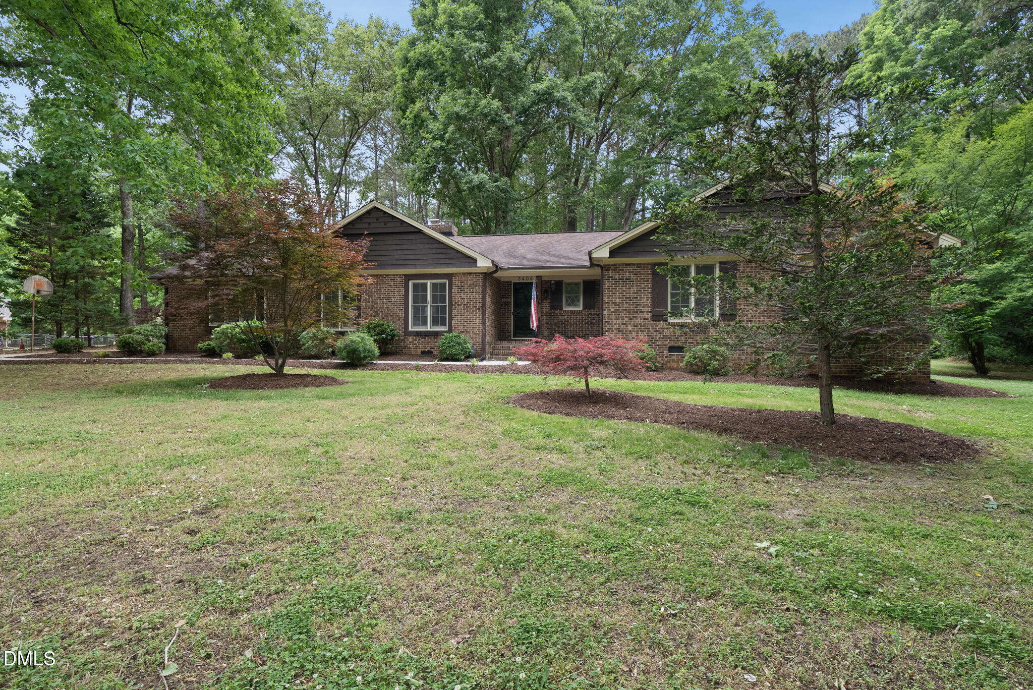 3404 Timberwood Court Raleigh, NC 27606 - Photo 41 of 45 a front view of house with yard and green space