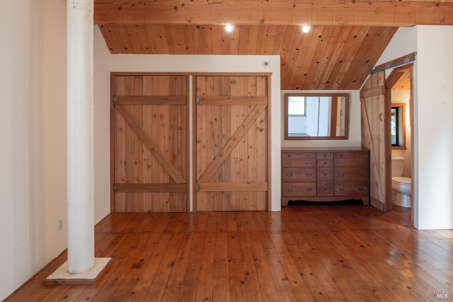 35244 Fly Cloud Road The Sea Ranch, CA 95497 - Photo 11 of 43 Primary with barn doors and wood floors.