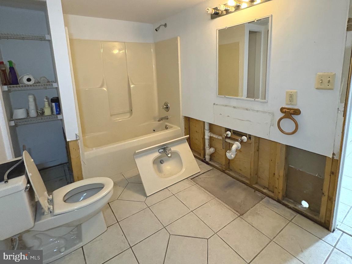 4215 Buffalo Road Mount Airy, MD 21771 - Photo 33 of 44 a bathroom with a sink a toilet and shower