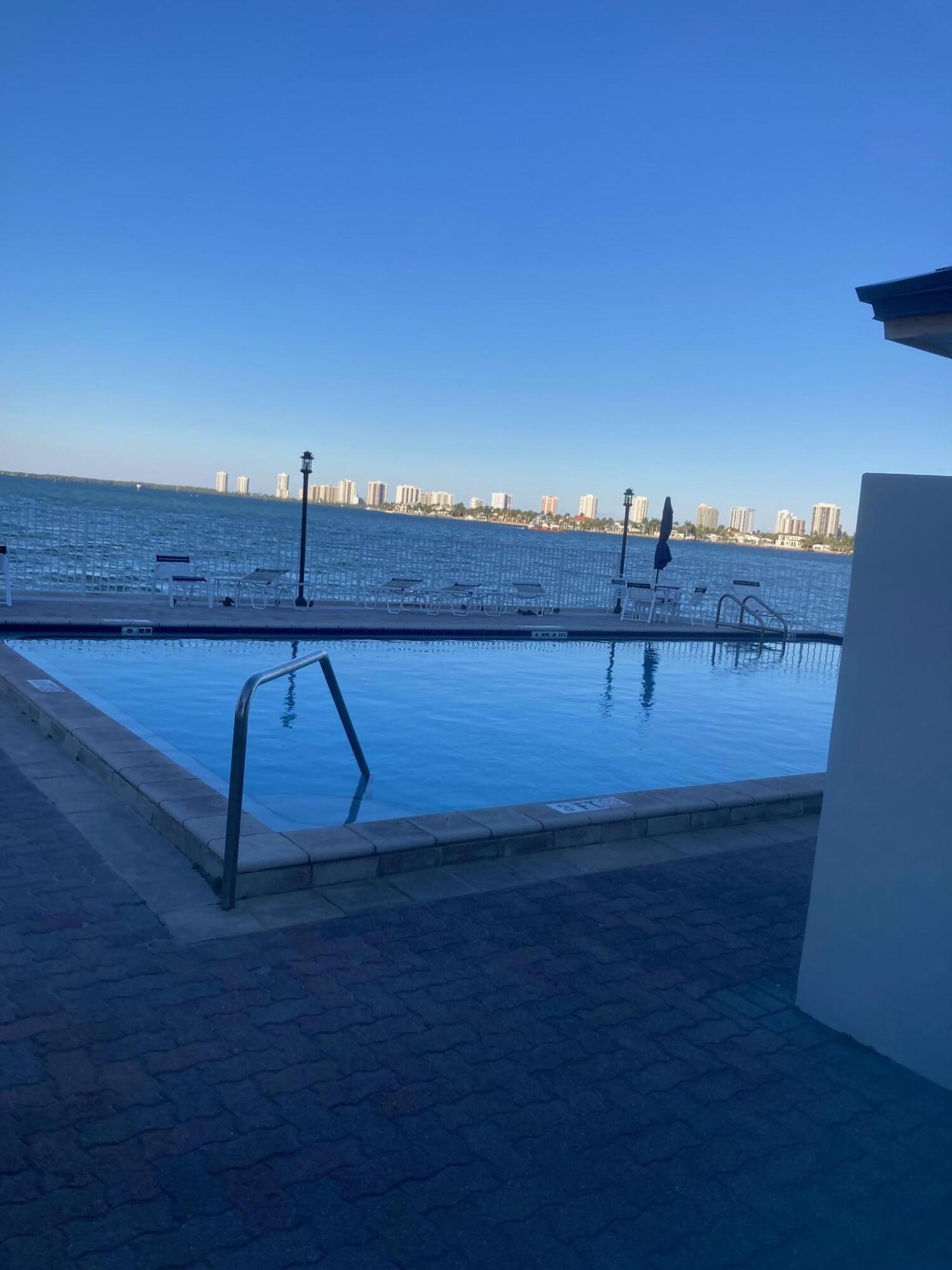 2936 Lake Shore Drive, Unit 409 Riviera Beach, FL 33404 - Photo 8 of 10 Outdoor Pool