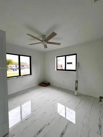 a view of an empty room with windows