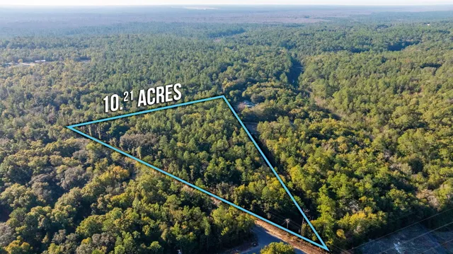 an aerial view of residential house and outdoor space