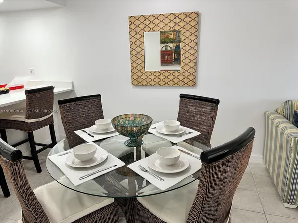 a view of a dining room that has table and chairs