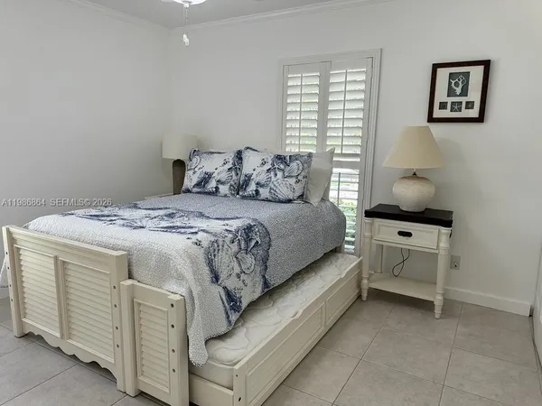 a bedroom with a bed and a cabinets