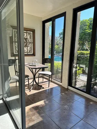 a view of a livingroom with furniture and a gate