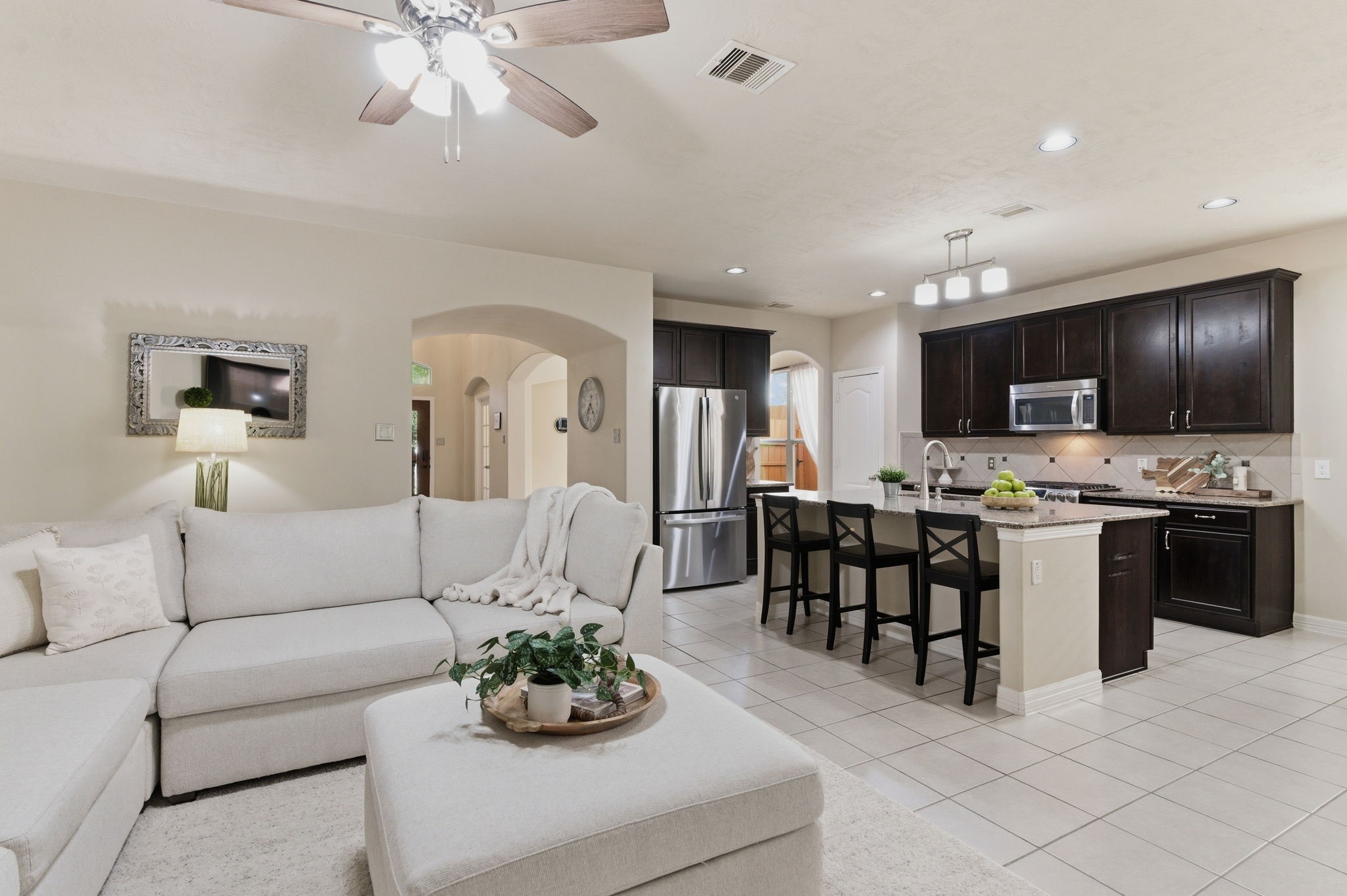 1737 Round Oak Lane Conroe, TX 77304 - Photo 7 of 39 a living room with furniture kitchen and a chandelier