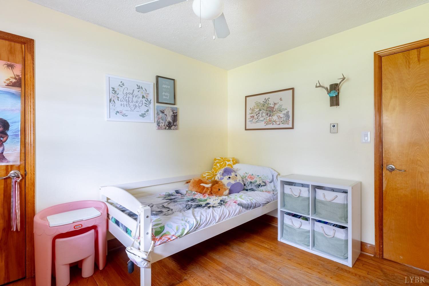 4100 Roark Mill Road Hurt, VA 24563 - Photo 20 of 42 a bedroom with a bed and wooden floor